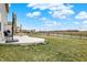 Beautiful backyard with a stone patio, black metal fencing, and green space by the water at 19970 Edwick Dr, Westfield, IN 46074