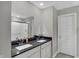 Modern bathroom with double sinks, granite countertop, and a glass-enclosed shower at 19970 Edwick Dr, Westfield, IN 46074