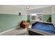 Cozy bedroom featuring a large window, neutral carpet, and modern decor at 19970 Edwick Dr, Westfield, IN 46074