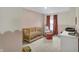 Charming Bedroom with pink walls, a cozy chair, and a wooden crib near the window at 19970 Edwick Dr, Westfield, IN 46074