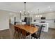 Open concept dining room next to modern kitchen with stainless steel appliances and adjacent butler's pantry at 19970 Edwick Dr, Westfield, IN 46074