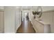 Inviting hallway with elegant wainscoting, wood floors, and decor at 19970 Edwick Dr, Westfield, IN 46074