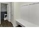 Hallway with a powder room, a white bench, and hooks on the wall at 19970 Edwick Dr, Westfield, IN 46074