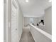 Bright hallway with neutral paint and carpet with access to multiple rooms at 19970 Edwick Dr, Westfield, IN 46074