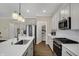 Modern kitchen with quartz countertops, stainless steel appliances, and a center island with seating at 19970 Edwick Dr, Westfield, IN 46074