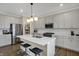Modern kitchen with quartz countertops, stainless steel appliances, and a center island with seating at 19970 Edwick Dr, Westfield, IN 46074