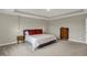 Spacious main bedroom featuring tray ceiling, modern fixtures, and plush carpeting at 19970 Edwick Dr, Westfield, IN 46074