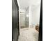 Bathroom with a glass enclosed tiled shower, mosaic tile floors, and modern vanity at 2037 Ruckle St, Indianapolis, IN 46202