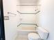 Bright bathroom with white tiles and blue accents, including a tub and shower at 2037 Ruckle St, Indianapolis, IN 46202