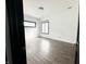 Bright bedroom with hardwood floors, white walls, and black trim windows at 2037 Ruckle St, Indianapolis, IN 46202