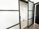 Modern walk in closet with frosted glass sliding doors and built in shelving at 2037 Ruckle St, Indianapolis, IN 46202