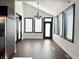 Bright dining area featuring hardwood floors and multiple windows at 2037 Ruckle St, Indianapolis, IN 46202