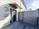 Private entrance with a modern door, covered awning, and privacy fence at 2037 Ruckle St, Indianapolis, IN 46202