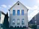 Two-story home with gray siding, white trim, black windows, and manicured front lawn at 2037 Ruckle St, Indianapolis, IN 46202
