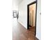 Open hallway showcasing hardwood floors and modern black door frames at 2037 Ruckle St, Indianapolis, IN 46202