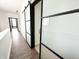 Hallway with hardwood floors and sliding closet doors at 2037 Ruckle St, Indianapolis, IN 46202