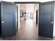Open floor plan with hardwood floors, view of the kitchen, living room, and staircase at 2037 Ruckle St, Indianapolis, IN 46202