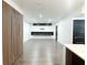 Living room featuring modern floating cabinets, recessed lights, and an accent wall at 2037 Ruckle St, Indianapolis, IN 46202