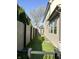 A fenced side yard featuring artificial turf and a concrete drain at 2037 Ruckle St, Indianapolis, IN 46202