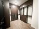 Spacious walk-in closet with custom dark wood built-ins, offering ample storage and organization at 2037 Ruckle St, Indianapolis, IN 46202