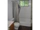 Bathroom featuring a bathtub with a shower curtain and a small window at 2194 N Riley Ave, Indianapolis, IN 46218
