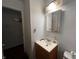 Modest bathroom showing vanity, lighting, mirror, and fixtures at 2194 N Riley Ave, Indianapolis, IN 46218