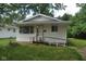 Modest single-story home featuring a small front yard and accessible ramp at 2194 N Riley Ave, Indianapolis, IN 46218
