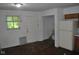 Shows the kitchen with a back door and some damage on the walls at 2194 N Riley Ave, Indianapolis, IN 46218