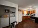 Kitchen and laundry area, featuring wood cabinets, white appliances, and convenient washer/dryer hookups at 2194 N Riley Ave, Indianapolis, IN 46218