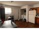 Functional kitchen featuring wood cabinets, white appliances, and laundry area at 2194 N Riley Ave, Indianapolis, IN 46218