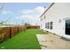Well-maintained backyard with a lush lawn, a patio area, and a privacy fence at 2885 Holiday Way, Greenwood, IN 46143