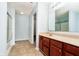 Well-lit bathroom with cherry-wood cabinets and a shower at 2885 Holiday Way, Greenwood, IN 46143