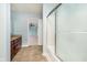 Bathroom with cherry-wood cabinets and view to bedroom at 2885 Holiday Way, Greenwood, IN 46143