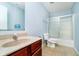 Bathroom featuring a single sink vanity and a shower/tub with sliding glass doors at 2885 Holiday Way, Greenwood, IN 46143