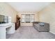 Bedroom showcasing a couch, dresser, and three windows, creating a comfortable space at 2885 Holiday Way, Greenwood, IN 46143