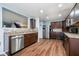 Well-equipped kitchen features stainless steel appliances, ample cabinet space, laminate floors, and modern fixtures at 2885 Holiday Way, Greenwood, IN 46143