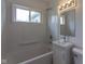 Bright bathroom features a shower and tub combination with a single sink vanity at 380 Parkway St, Whiteland, IN 46184