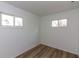 Bedroom with two windows and laminate flooring at 380 Parkway St, Whiteland, IN 46184