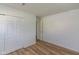 Bright bedroom featuring laminate flooring and a closet at 380 Parkway St, Whiteland, IN 46184