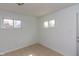 Bedroom with tile flooring, bright white walls and two windows at 380 Parkway St, Whiteland, IN 46184