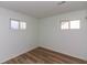 Sunny bedroom showcasing laminate flooring and large windows at 380 Parkway St, Whiteland, IN 46184