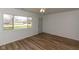Inviting living room boasting laminate floors, large window, and fresh white walls at 380 Parkway St, Whiteland, IN 46184