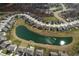 Beautiful aerial view of homes surrounding a scenic pond in a well-maintained community at 4148 Basswood Dr, Danville, IN 46122