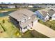 Aerial view of a home showcasing a landscaped yard, inviting porch, and waterfront property at 4148 Basswood Dr, Danville, IN 46122