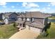 Striking aerial view of a home showcasing its well-manicured lawn, curb appeal, and 3 car garage at 4148 Basswood Dr, Danville, IN 46122