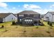Aerial backyard view shows spacious layout with a patio area perfect for outdoor gatherings at 4148 Basswood Dr, Danville, IN 46122