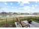 Enjoy a peaceful pond view from this home's backyard seating area with a fire pit at 4148 Basswood Dr, Danville, IN 46122