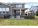 Home's outdoor living space featuring a fenced backyard with covered patio and furniture at 4148 Basswood Dr, Danville, IN 46122