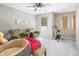 Comfortable bedroom with exercise bike, a ceiling fan, and cozy seating for leisure and fitness at 4148 Basswood Dr, Danville, IN 46122