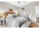 Relaxing bedroom featuring a comfortable bed with woven headboard, soft lighting, and calming color palette at 4148 Basswood Dr, Danville, IN 46122